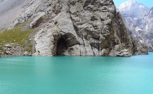 The caves in the rocks of Kol-Suu Lake